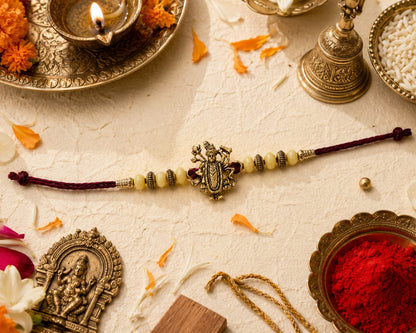 Maa Durga Rakhi Antique Gold Finish Beaded Rakhi Maroon Thread