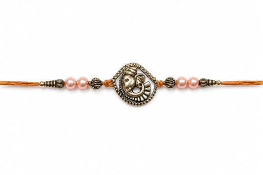 Ganesha Rakhi Antique Silver Finish Pearl Beaded Rakhi Peach