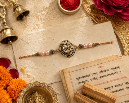 Ganesha Rakhi Antique Silver Finish Pearl Beaded Rakhi Peach
